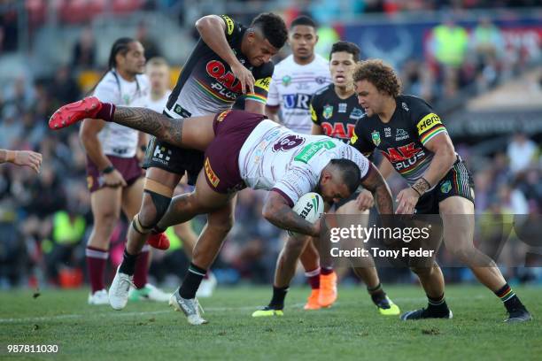 Addin Fonua-Blake of the Sea Eagles is tackled during the round 16 NRL match between the Penrith Panthers and the Manly Sea Eagles at Panthers...