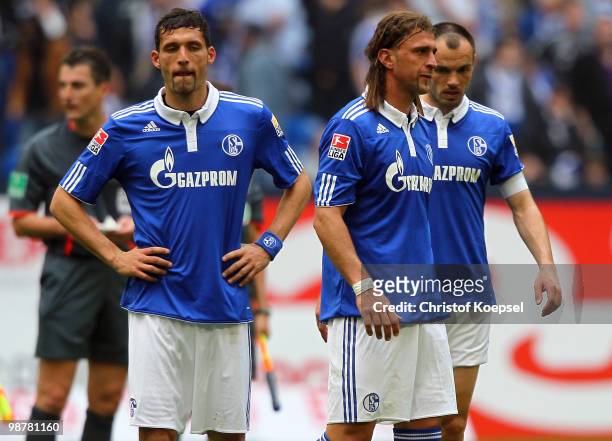 Kevin Kuranyi of Schalke, Marcelo Bordon and Heiko Westermann look dejected after losing 0-2 the Bundesliga match between FC Schalke 04 and SV Werder...