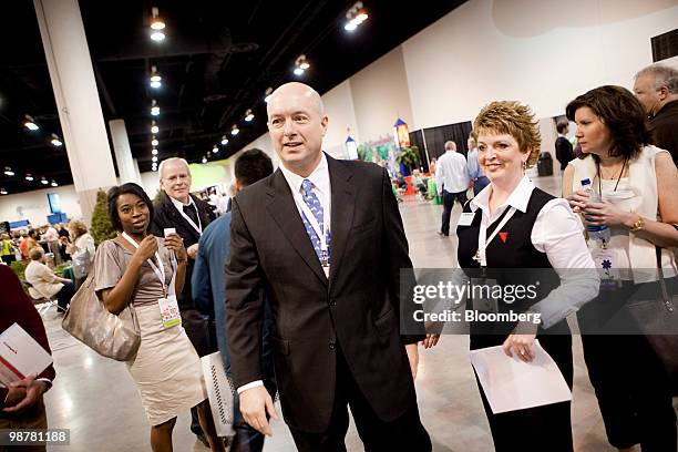 David Sokol, chairman of Berkshire Hathaway's MidAmerican Energy Holdings Co., speaks to shareholders on the exhibition floor prior to the Berkshire...