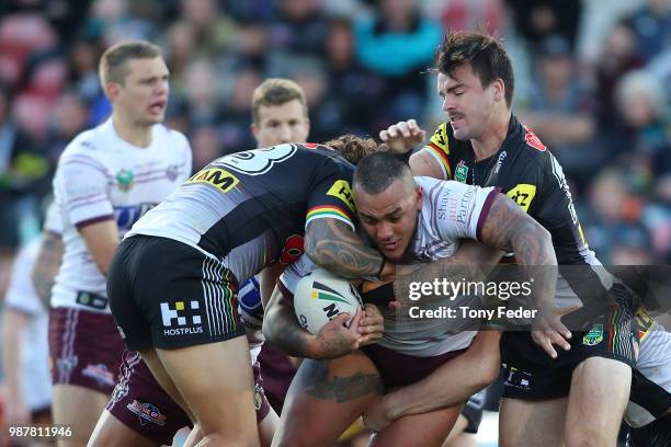 Addin Fonua-Blake of the Sea Eagles is tackled during the round 16 NRL match between the Penrith Panthers and the Manly Sea Eagles at Panthers...