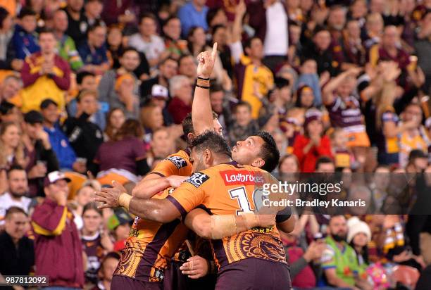 Alex Glenn of the Broncos celebrates scoring a try during the round 16 NRL match between the Brisbane Broncos and the Canberra Raiders at Suncorp...