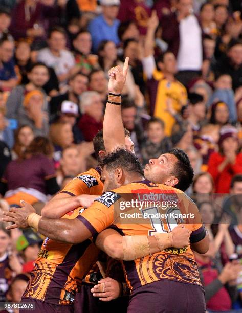 Alex Glenn of the Broncos celebrates scoring a try during the round 16 NRL match between the Brisbane Broncos and the Canberra Raiders at Suncorp...