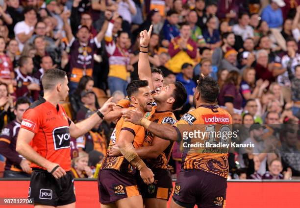 Alex Glenn of the Broncos celebrates scoring a try during the round 16 NRL match between the Brisbane Broncos and the Canberra Raiders at Suncorp...