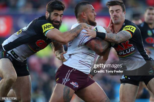 Addin Fonua-Blake of the Sea Eagles is tackled during the round 16 NRL match between the Penrith Panthers and the Manly Sea Eagles at Panthers...