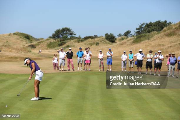Stephanie Lau of The USA makes a putt during a semi final on day five of The Ladies' British Open Amateur Championship at Hillside Golf Club on June...