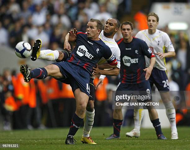 Bolton Wanderers' English striker Kevin Davies vies for the ball with Tottenham's french defender Younes Kaboul during the English Premier League...