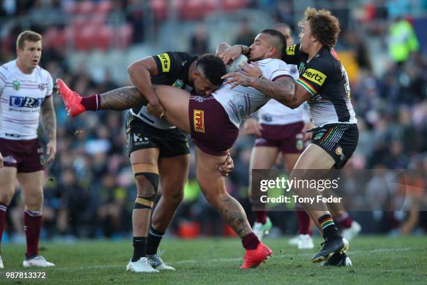 Addin Fonua-Blake of the Sea Eagles is tackled during the round 16 NRL match between the Penrith Panthers and the Manly Sea Eagles at Panthers...