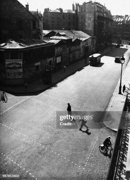 Undated picture shows a man walking across the Gay Lussac street in Paris.