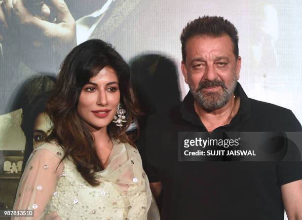 Indian Bollywood actors Chitrangada Singh and Sanjay Dutt pose for a picture during the trailer launch of the upcoming drama Hindi film 'Saheb, Biwi...