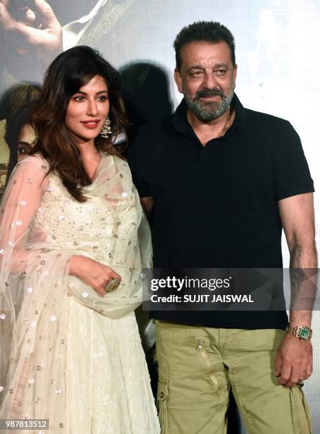 Indian Bollywood actors Chitrangada Singh and Sanjay Dutt pose for a picture during the trailer launch of the upcoming drama Hindi film 'Saheb, Biwi...