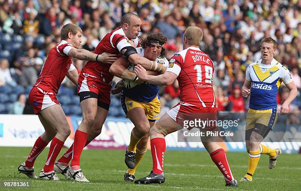 Ben Harrison of Warrington Wolves gets tackled by Ian Sibbit and Ryan Boyle of Salford City Reds during the Engage Rugby Super League Magic Weekend...