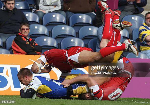 Chris Hicks of Warrington Wolves scores a try during the Engage Rugby Super League Magic Weekend match between Salford City Reds and Warrington...