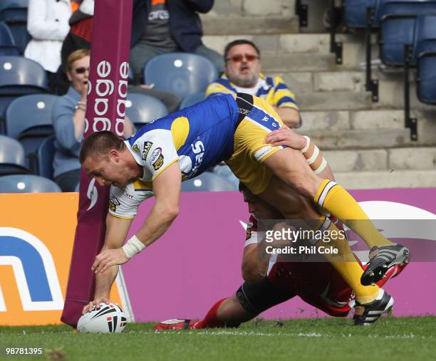 Chris Hicks of Warrington Wolves scores a try during the Engage Rugby Super League Magic Weekend match between Salford City Reds and Warrington...