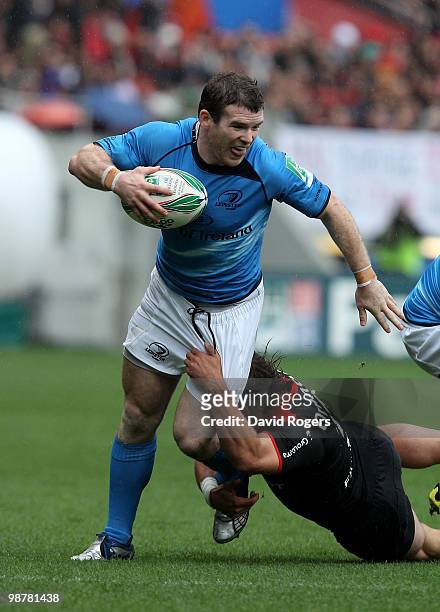 Gordon D'Arcy of Leinster is tackled by Cedric Heymans during the Heineken Cup semi final match between Toulouse and Leinster at Stade Municipal on...