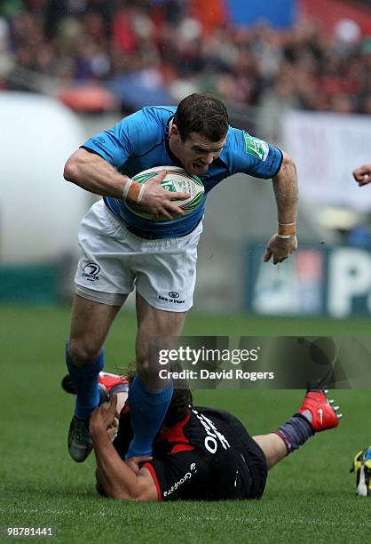 Gordon D'Arcy of Leinster is tackled by Cedric Heymans during the Heineken Cup semi final match between Toulouse and Leinster at Stade Municipal on...