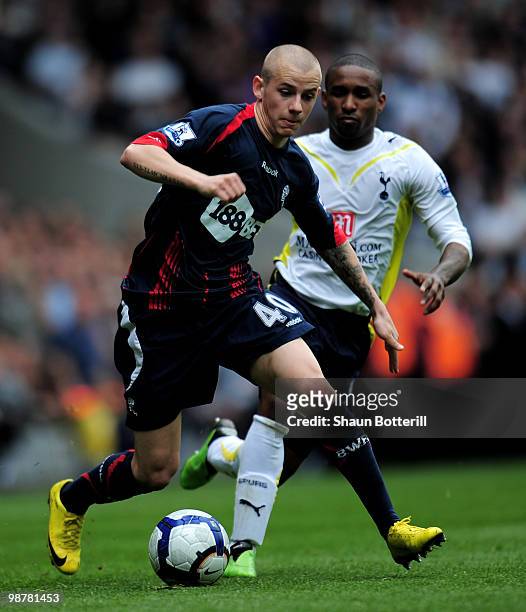 Vladimir Weiss of Bolton Wanderers breaks away from Jermain Defoe of Tottenham Hotspur during the Barclays Premier League match between Tottenham...