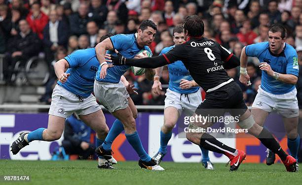 Rob Kearney of Leinster is tackled by Shaun Sowerby during the Heineken Cup semi final match between Toulouse and Leinster at Stade Municipal on May...