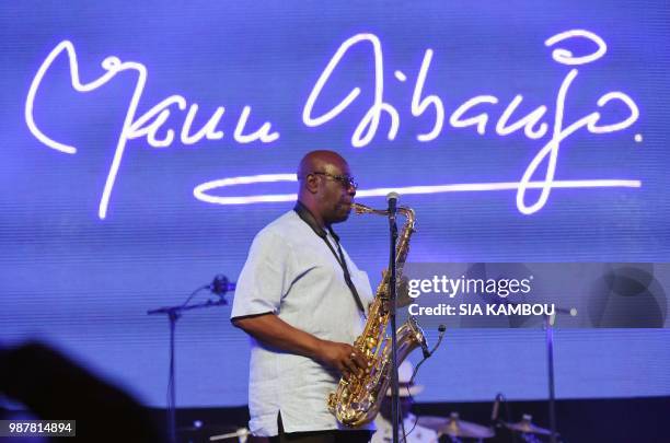 Emmanuel N'Djoke Dibango, known as Manu Dibango, saxophonist and Franco-Cameroonian singer of world jazz, performs during his concert on June 29,...