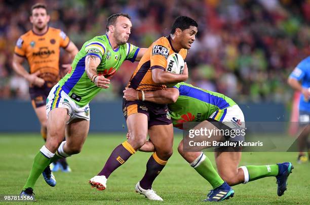 Anthony Milford of the Broncos takes on the defence during the round 16 NRL match between the Brisbane Broncos and the Canberra Raiders at Suncorp...
