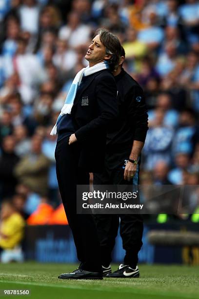 Roberto Mancini the Manchester City manager reacts during the Barclays Premier League match between Manchester City and Aston Villa at the City of...