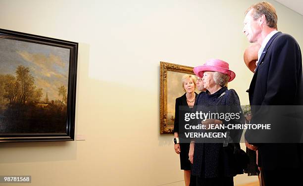 Queen Beatrix of Netherlands and Grand Duke Henri of Luxembourg look at paintings during the inauguration of the Villa Vauban, a new museum of...