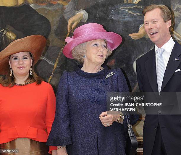 Queen Beatrix of Netherlands , Grand Duke Henri of Luxembourg and Grande Duchess Maria Teresa of Luxembourg pose during the inauguration of new...
