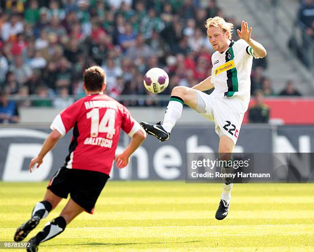 Tobias Levels of Moenchengladbach battles for the ball with Hanno Balitsch of Hannover during the Bundesliga match between Hannover 96 and Borussia...