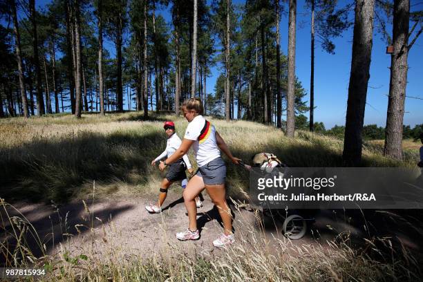 Jaclyn Lee of Canada and Leonie Harm of Germany walk to a tee during a semi final on day five of The Ladies' British Open Amateur Championship at...