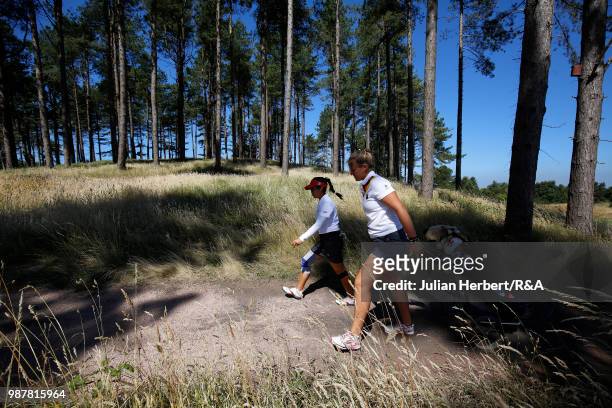 Jaclyn Lee of Canada and Leonie Harm of Germany walk to a tee during a semi final on day five of The Ladies' British Open Amateur Championship at...