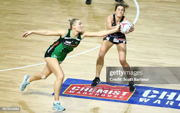 Shae Brown of the Magpies and Courtney Bruce of the Fever compete for the ball during the round nine Super Netball match between the Magpies and the...