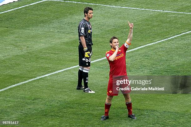 Francesco Totti of AS Roma celebrates after scoring the opening goal as goalkeeper Antonio Mirante of Parma looks on during the Serie A match between...