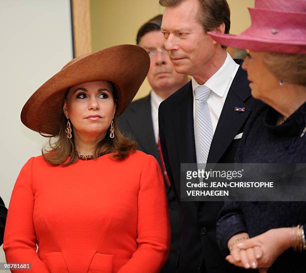 Grand Duke Henri and Grande Duchess Maria Teresa of Luxembourg speak with Queen Beatrix of Netherlands during the inauguration of the Villa Vauban, a...