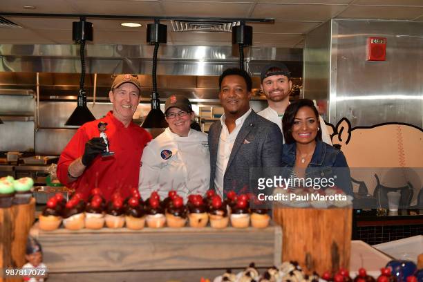 Paedro and Carolina Martinez pose with Chef Ron Abell at the Pedro Martinez Charity Feast With 45 at Fenway Park on June 29, 2018 in Boston,...