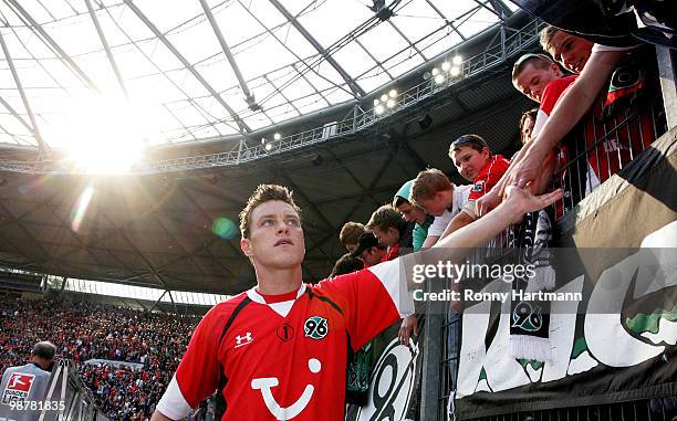 Hanno Balitsch of Hannover celebrate with the fans after the Bundesliga match between Hannover 96 and Borussia Moenchengladbach at AWD Arena on May...