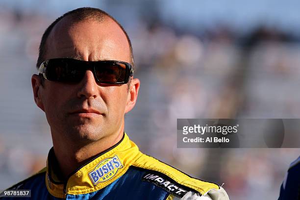 Marcos Ambrose,, driver of Bush's Best Baked Beans / Kingsford Toyota, looks on during qualifying for the NASCAR Sprint Cup Series Crown Royal...