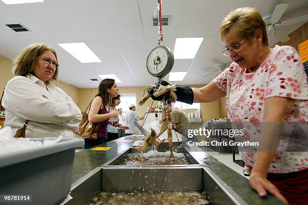 Amy Lanteigne orders 20 pounds of 10-12 count shrimp from Rosie Burger at Schaefer & Rusich Seafood on May 1, 2010 in New Orleans, Louisiana. Many...