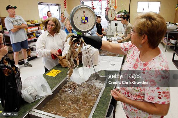 Amy Lanteigne orders 20 pounds of 10-12 count shrimp from Rosie Burger at Schaefer & Rusich Seafood on May 1, 2010 in New Orleans, Louisiana. Many...