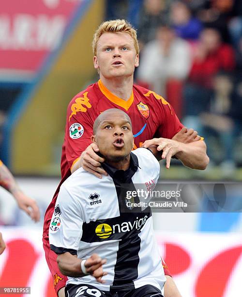 Jonathan Biabiany of Parma FC competes for the ball with John Arne Riise of AS Roma during the Serie A match between Parma FC and AS Roma at Stadio...