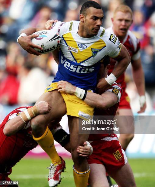 Ryan Atkins of Warrington is held up by the defence during the Engage Super League Magic Weekend game between Salford City Reds and Warrington Wolves...