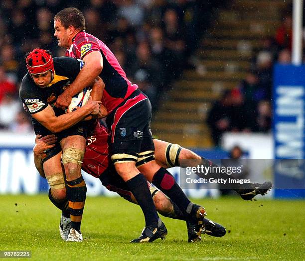 Dan Ward-Smith of London Wasps is challenged by Xavier Rush of Cardiff Blues during the Amlin Challenge Cup Semi Final match between London Wasps and...