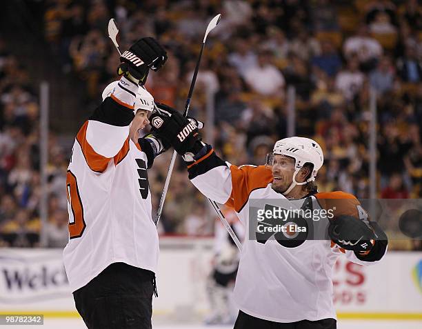 Chris Pronger of the Philadelphia Flyers celebrates his goal with teammate Kimmo Timonen in the second period against the Boston Bruins in Game One...