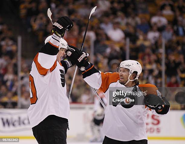 Chris Pronger of the Philadelphia Flyers celebrates his goal with teammate Kimmo Timonen in the second period against the Boston Bruins in Game One...