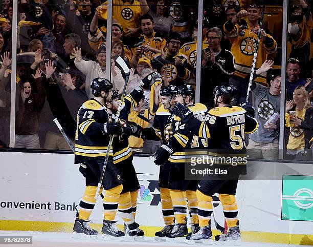 Miroslav Satan of the Boston Bruins is congratulated by teammates Milan Lucic,Dennis Wideman,Michael Ryder and Johnny Boychuk after Satan scored in...
