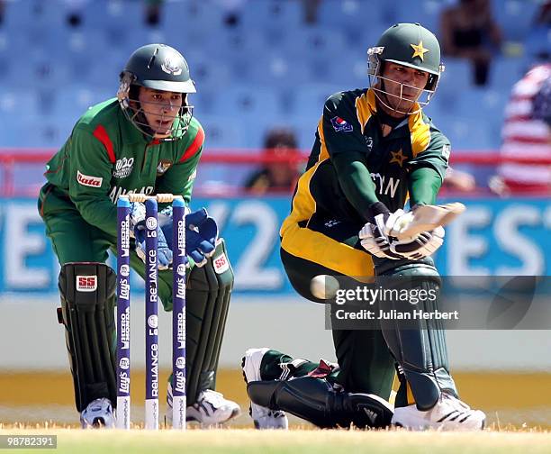 Mushfiqur Rahim watches as Salman Butt of Pakistan scores runs during The ICC World Twenty20 Group A match between Pakistan and Bangladesh played at...