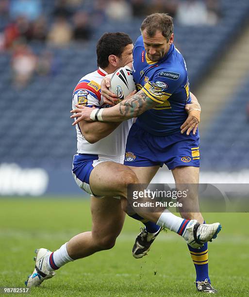 Jamie Peacock of Leeds Rhinos is tackled by Michael Korkidas of Wakefield Trinity during the Engage Rugby Super League Magic Weekend match between...