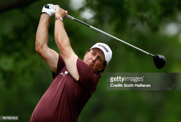 Phil Mickelson watches his tee shot on the fourth hole during the third round of the 2010 Quail Hollow Championship at the Quail Hollow Club on May...