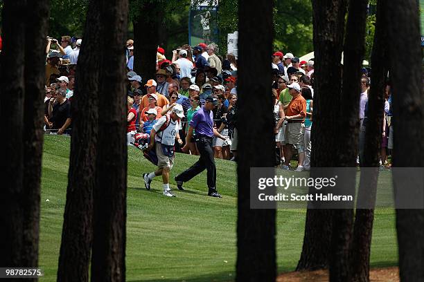 Jim Furyk walks off the first tee with his caddie Mike Cowan during the third round of the 2010 Quail Hollow Championship at the Quail Hollow Club on...