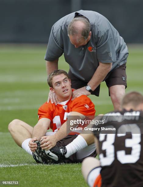 Colt McCoy of the Cleveland Browns talks with team president Mike Holmgren during rookie mini camp at the Cleveland Browns Training and...