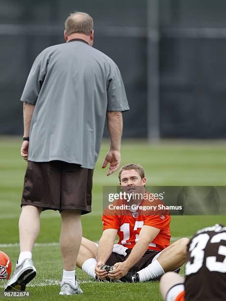 Colt McCoy of the Cleveland Browns talks with team president Mike Holmgren during rookie mini camp at the Cleveland Browns Training and...