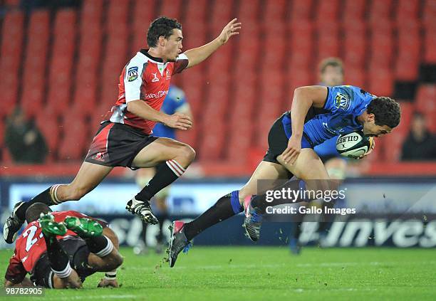 Sam Harris of the Force is chased by Jacques Coetzee of the Lions during the Super 14 Round 12 match between Auto and General Lions and Western Force...